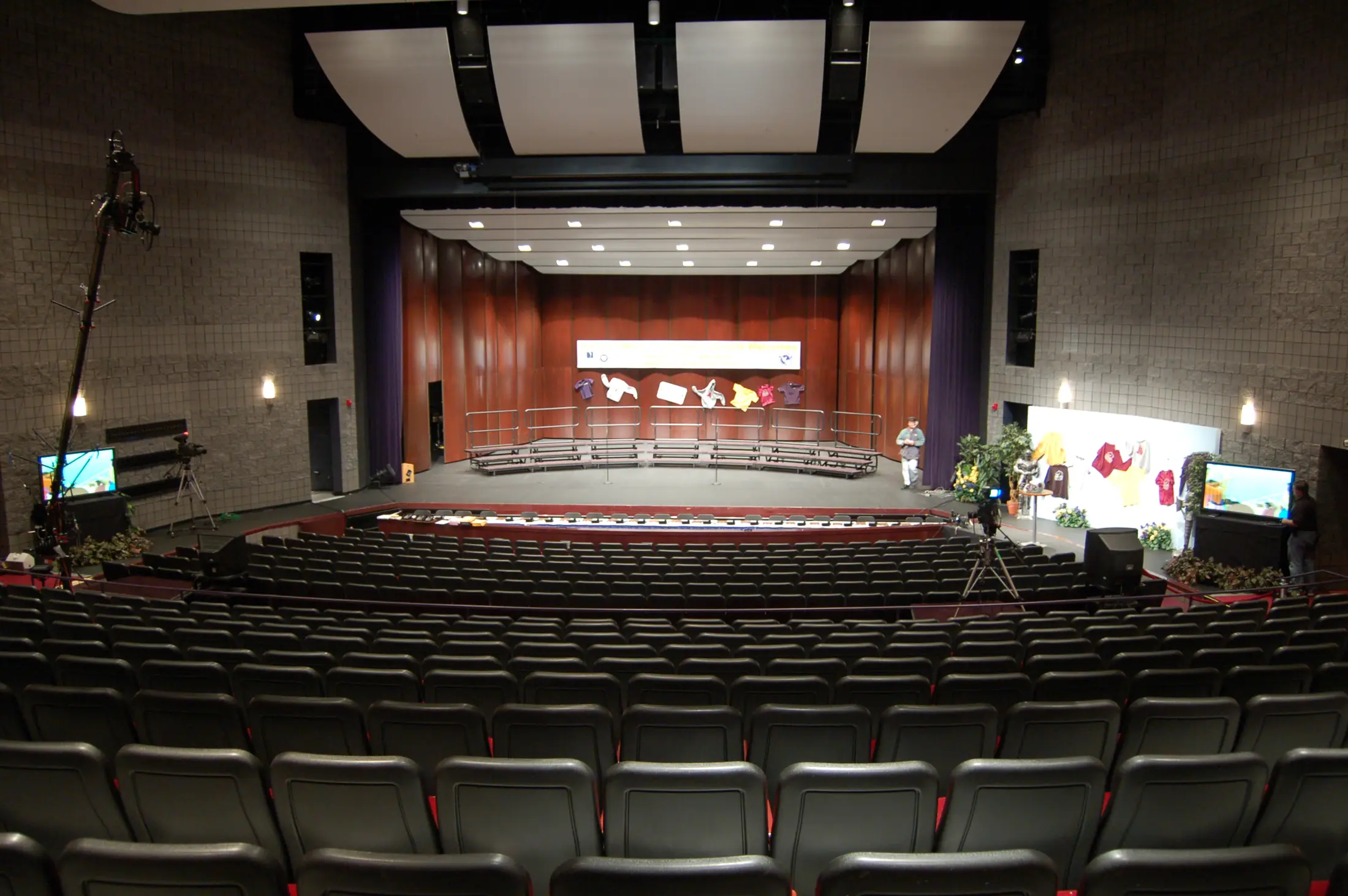 A ceremony stage with cameras in the house
